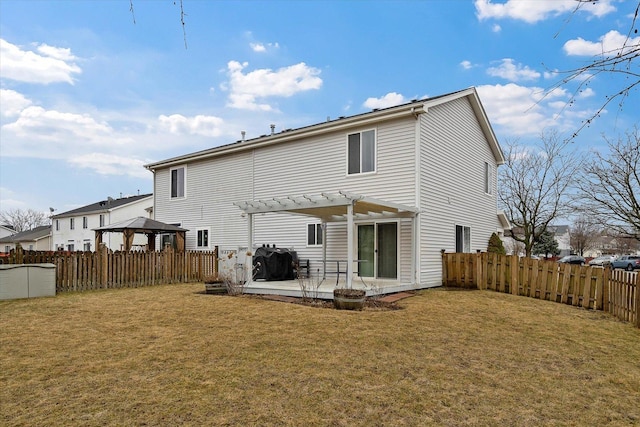 back of property with a gazebo, a patio, a pergola, and a yard