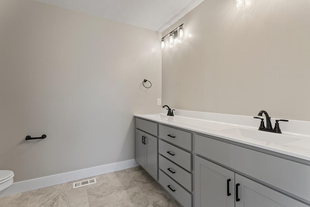 full bathroom featuring a sink, visible vents, and marble finish floor