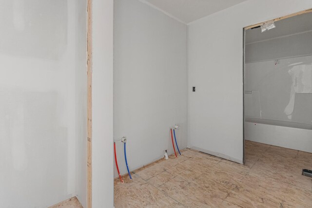 carpeted spare room with ceiling fan and baseboards