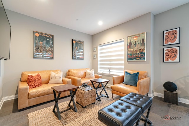 living room with wood finished floors and baseboards