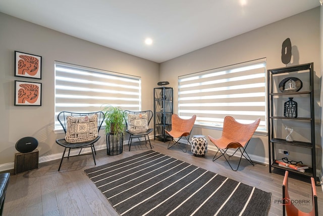 sitting room featuring recessed lighting, wood finished floors, and baseboards