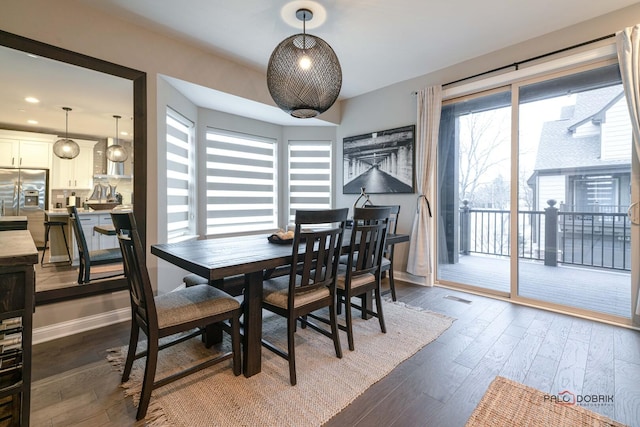 dining space with dark wood-type flooring, recessed lighting, baseboards, and visible vents