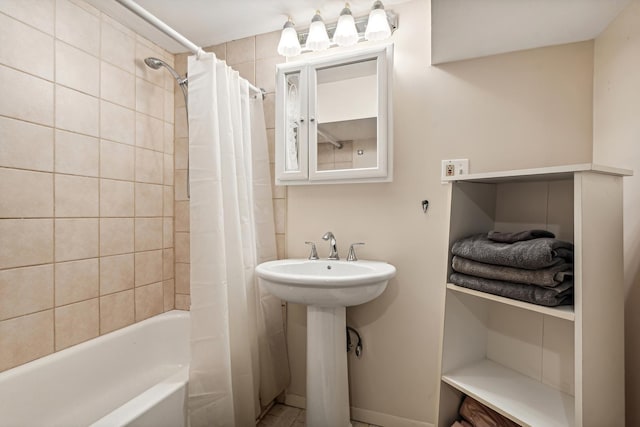 full bath with shower / tub combo and a sink