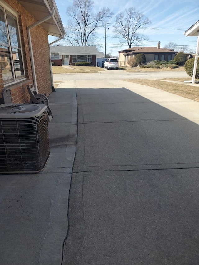 exterior space with concrete driveway