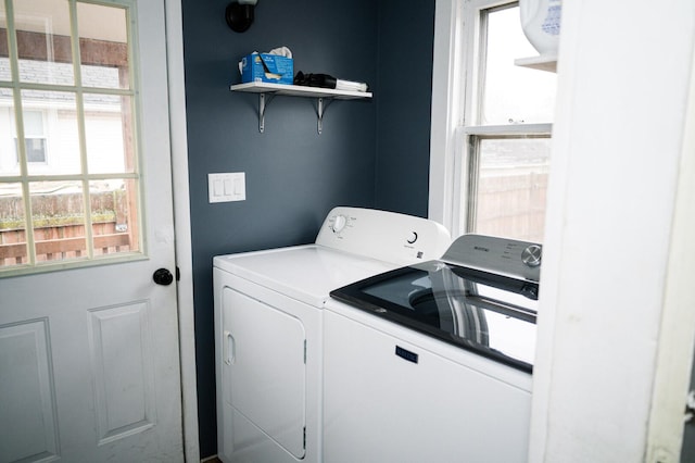 laundry area with laundry area and washing machine and clothes dryer