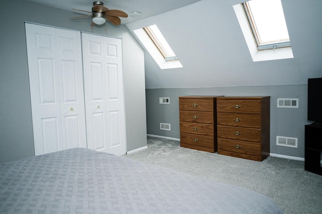 unfurnished bedroom featuring lofted ceiling, visible vents, and a closet