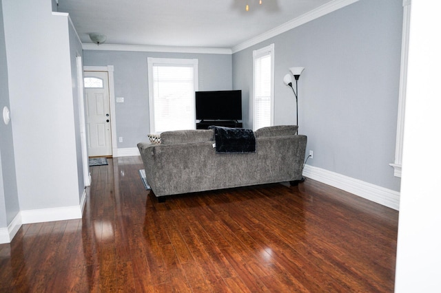 living room with dark wood-style floors, baseboards, and crown molding