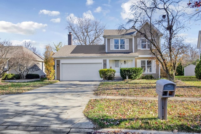 traditional home with driveway, a chimney, and an attached garage