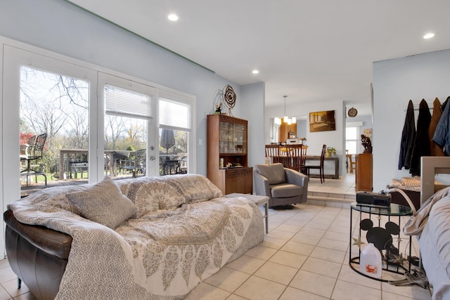 living area featuring recessed lighting, a notable chandelier, and light tile patterned floors