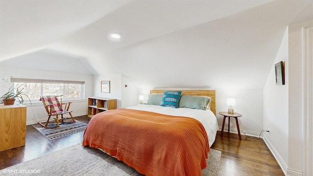 bedroom featuring recessed lighting, baseboards, lofted ceiling, and wood finished floors