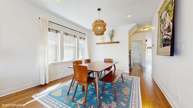 dining room featuring recessed lighting, baseboards, and wood finished floors