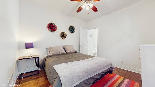 bedroom featuring baseboards, wood finished floors, and a ceiling fan