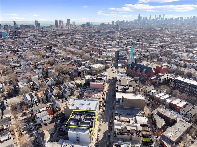 birds eye view of property with a city view