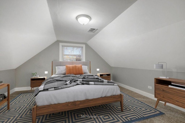 carpeted bedroom featuring vaulted ceiling, visible vents, and baseboards