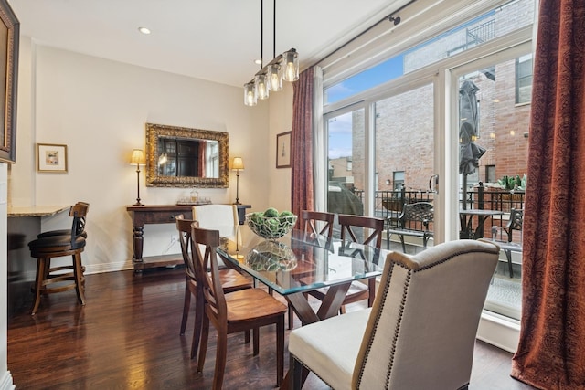 dining room featuring recessed lighting, baseboards, and dark wood-style flooring