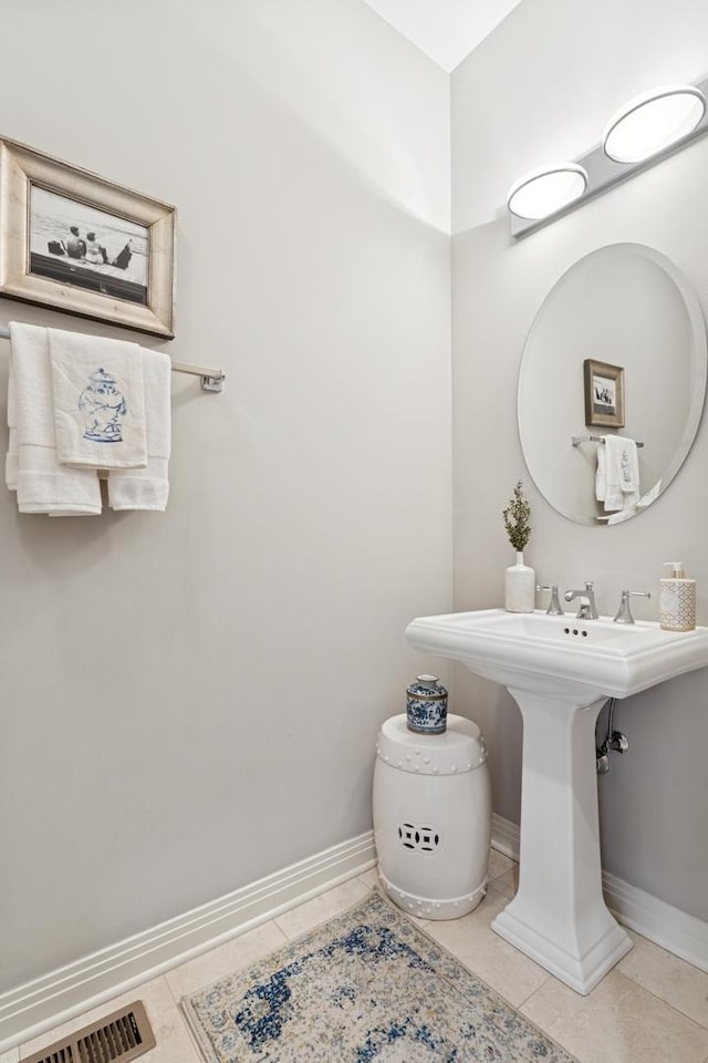 bathroom with visible vents, baseboards, and tile patterned flooring