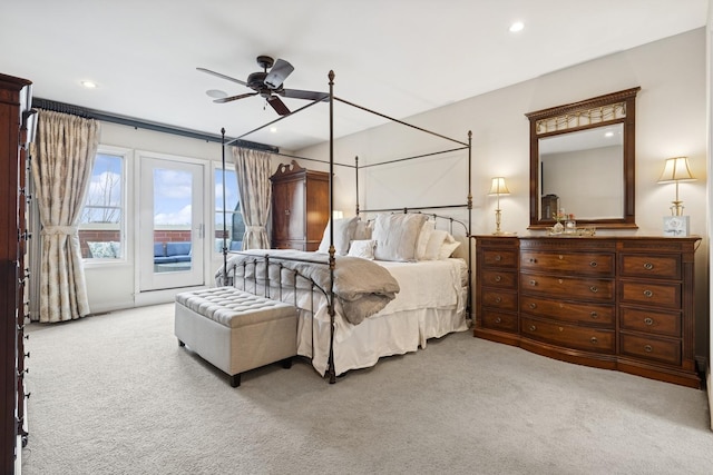 carpeted bedroom with recessed lighting and access to exterior