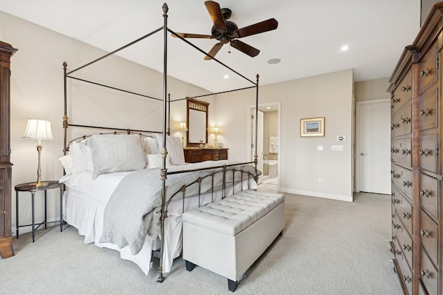 carpeted bedroom with recessed lighting, connected bathroom, and baseboards