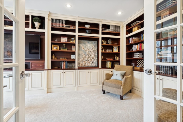 sitting room with carpet flooring and recessed lighting