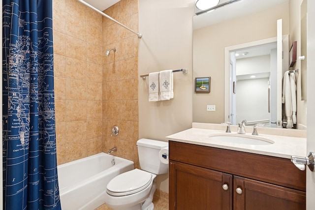 bathroom with vanity, toilet, and shower / tub combo