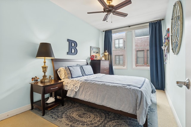 bedroom featuring baseboards, carpet, and a ceiling fan