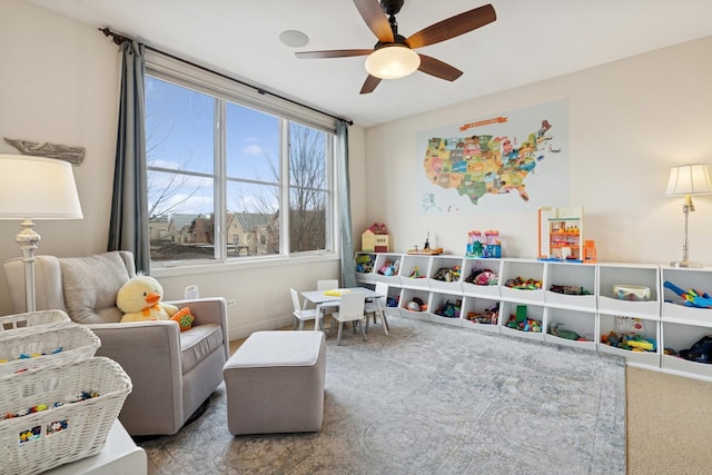 carpeted bedroom with baseboards and ceiling fan