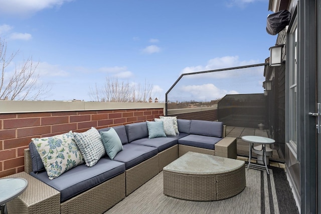 view of patio / terrace featuring an outdoor living space and fence