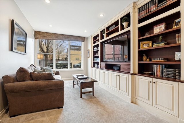 living room with recessed lighting and light carpet