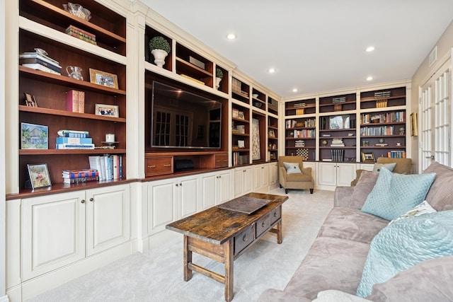 living area featuring recessed lighting and light carpet