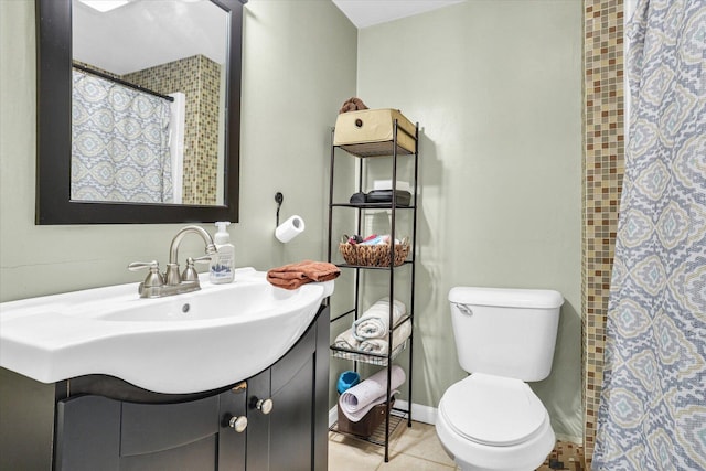 bathroom featuring curtained shower, tile patterned flooring, toilet, vanity, and baseboards