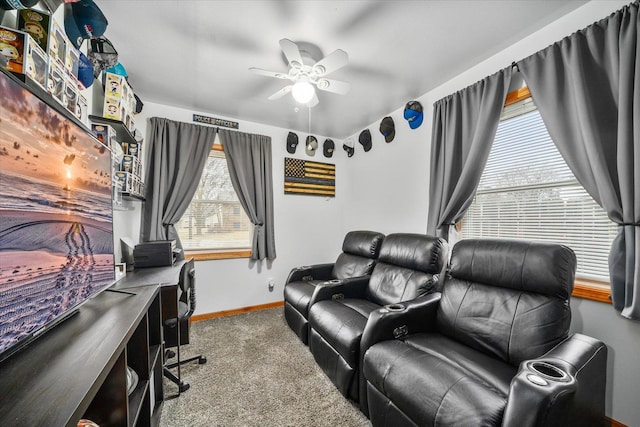 office space with carpet floors, ceiling fan, and baseboards