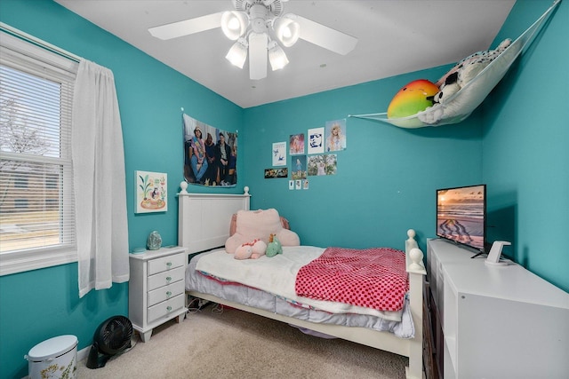 bedroom with ceiling fan and carpet flooring