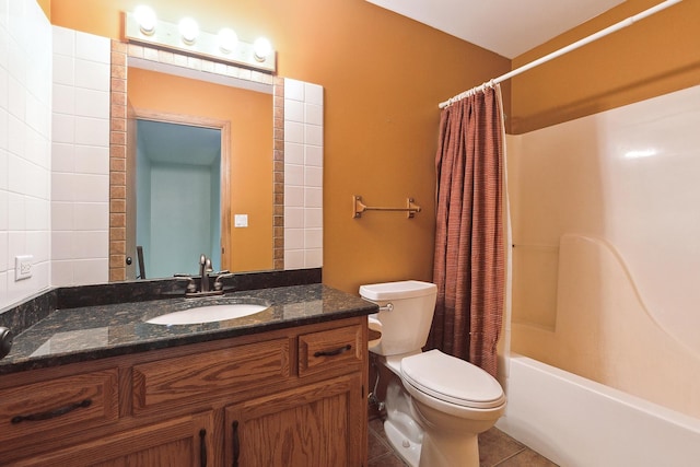 bathroom featuring tile patterned flooring, toilet, vanity, and shower / tub combo