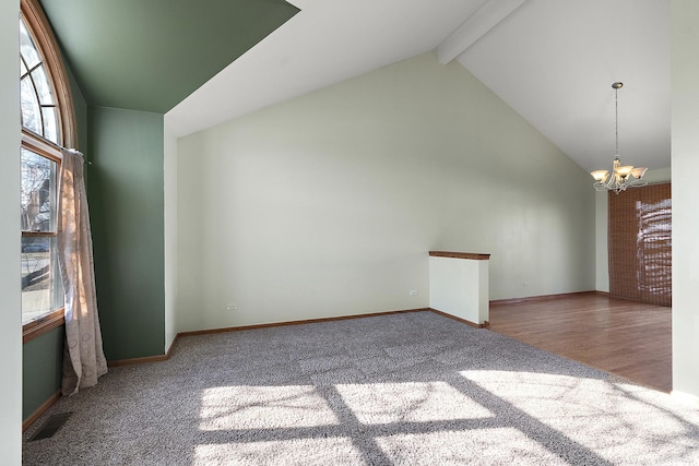 empty room with beamed ceiling, high vaulted ceiling, carpet flooring, baseboards, and a chandelier