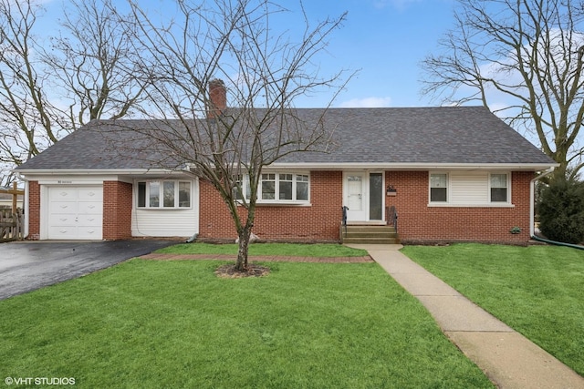 ranch-style house with roof with shingles, brick siding, a chimney, and a front yard