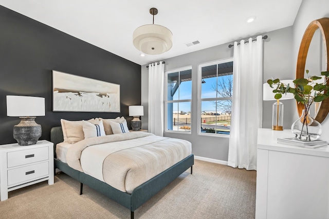 bedroom featuring light colored carpet, visible vents, baseboards, and recessed lighting