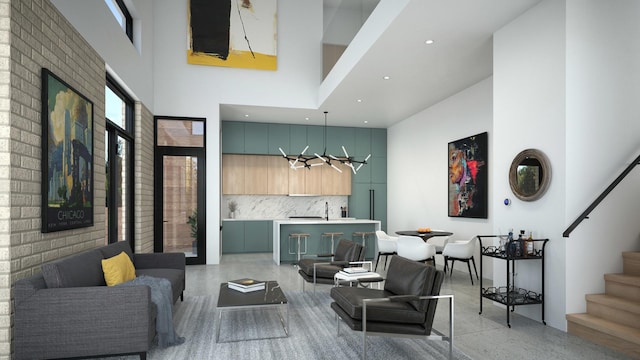 living area featuring light speckled floor, a chandelier, recessed lighting, a towering ceiling, and stairs