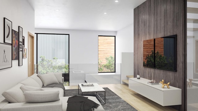 living room with wood finished floors and recessed lighting