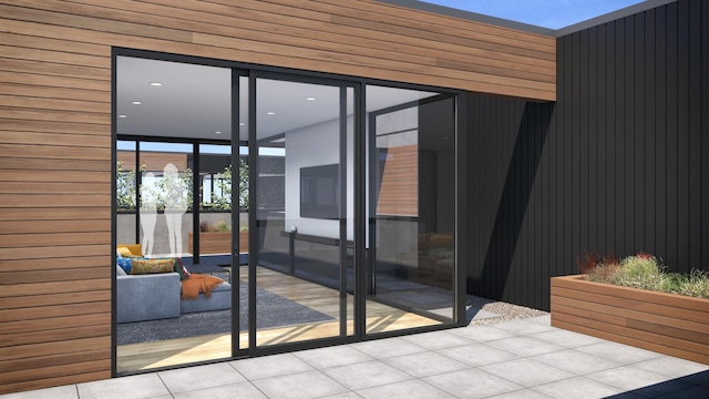 doorway featuring floor to ceiling windows and tile patterned floors