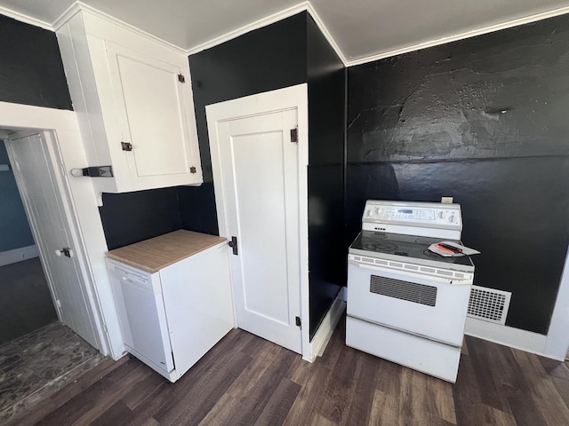 kitchen with dark wood-style floors, white range with electric stovetop, light countertops, visible vents, and white cabinets