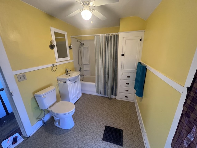 bathroom with toilet, visible vents, a ceiling fan, vanity, and shower / tub combo with curtain