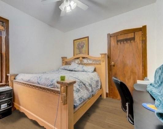 bedroom with wood finished floors and ceiling fan