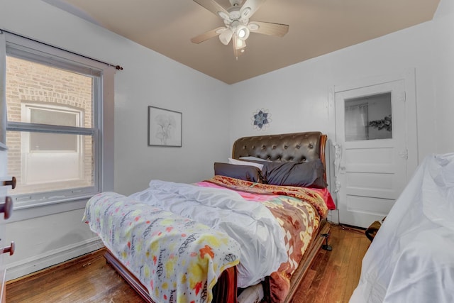 bedroom with hardwood / wood-style floors and ceiling fan