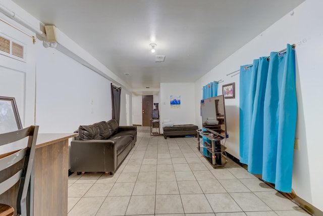 living room with visible vents and light tile patterned flooring