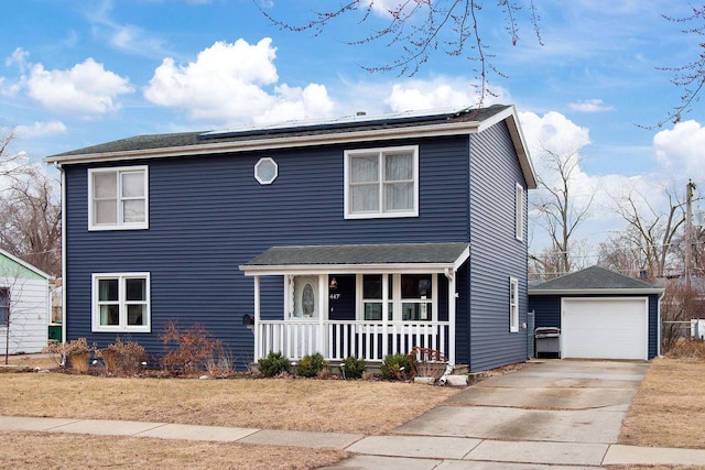 traditional-style home featuring an outbuilding, a detached garage, roof mounted solar panels, a porch, and concrete driveway