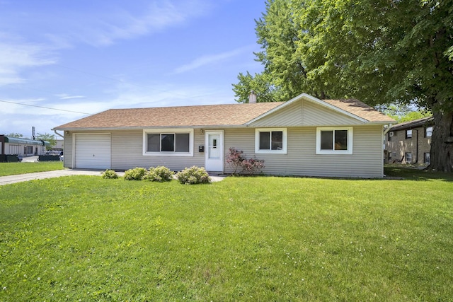 ranch-style home featuring a garage, concrete driveway, and a front lawn