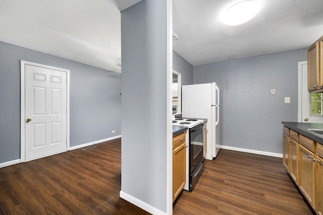 kitchen with dark countertops, baseboards, dark wood finished floors, and electric stove