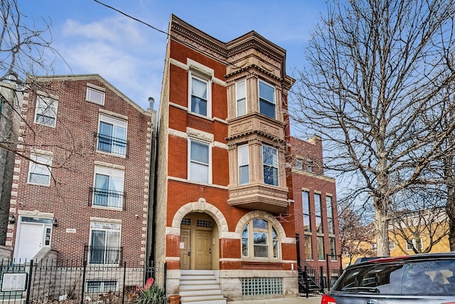 view of building exterior featuring a fenced front yard