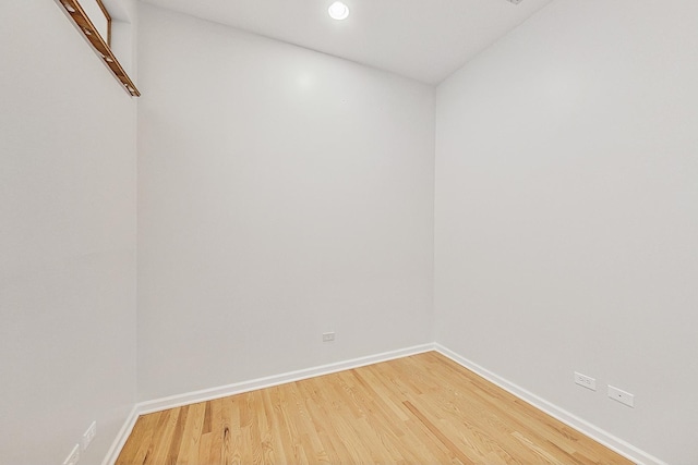 unfurnished room with recessed lighting, baseboards, and light wood finished floors