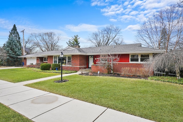 single story home featuring a front yard, a shingled roof, concrete driveway, a garage, and brick siding